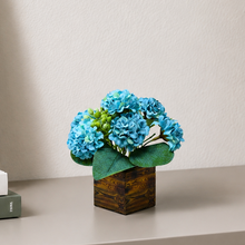 Single pc china genda (7 flowers + 7 beads) in printed wood pot