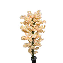 4 feet Artificial Flower plant in black pot placed  in the corner of living room
